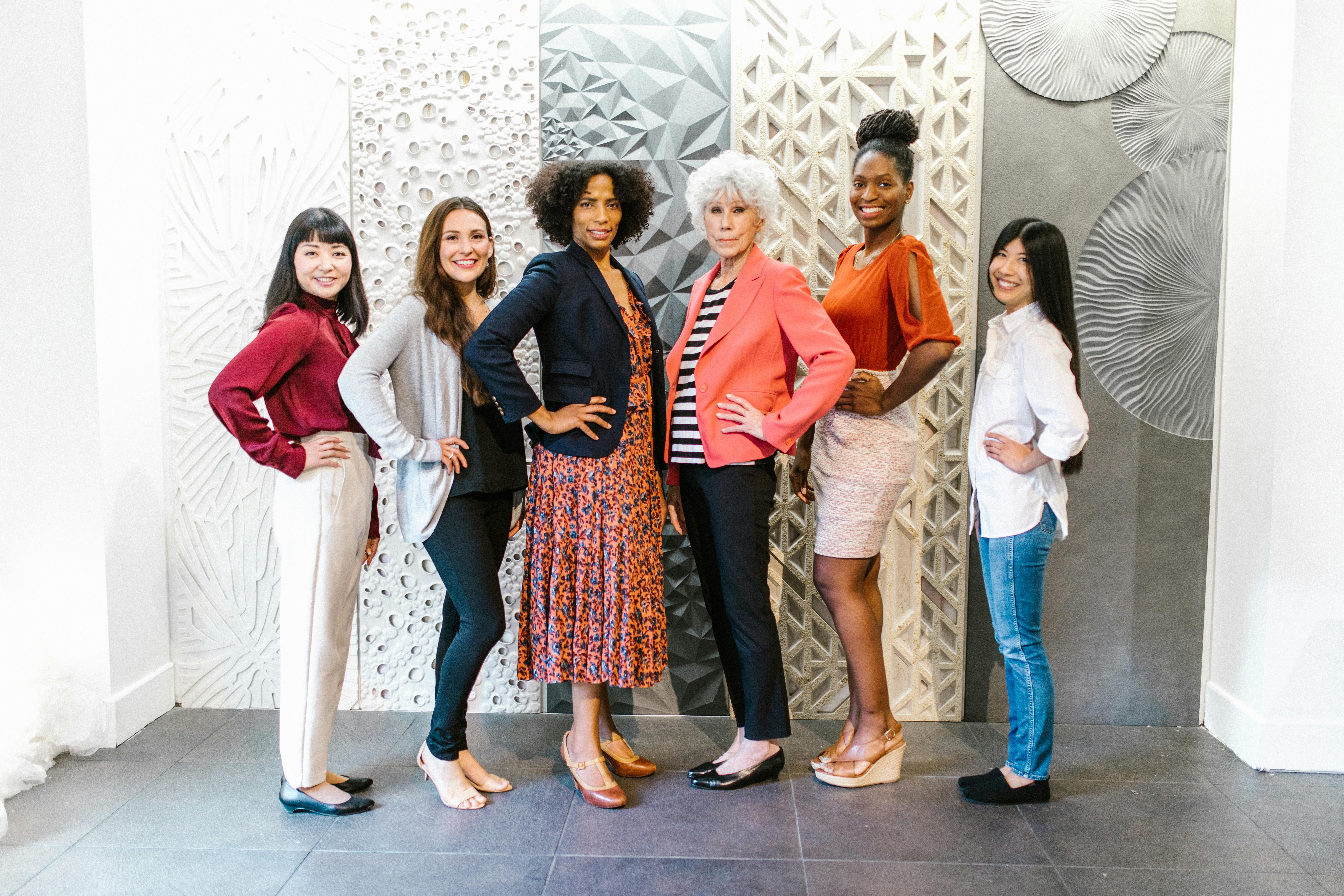 Diverse group of women nonprofit start community standing for posed photo. 